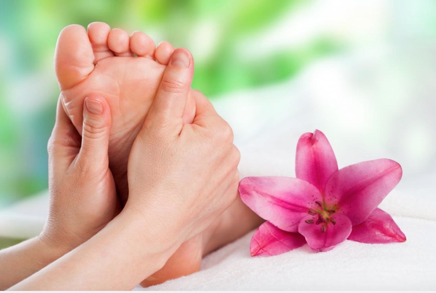 massaging feet with Neals Yard Arnica Salve gets rid of chilblains